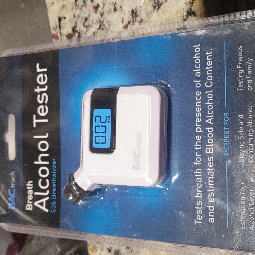 Breath alcohol tester made by BACktrack. Small white brand new.